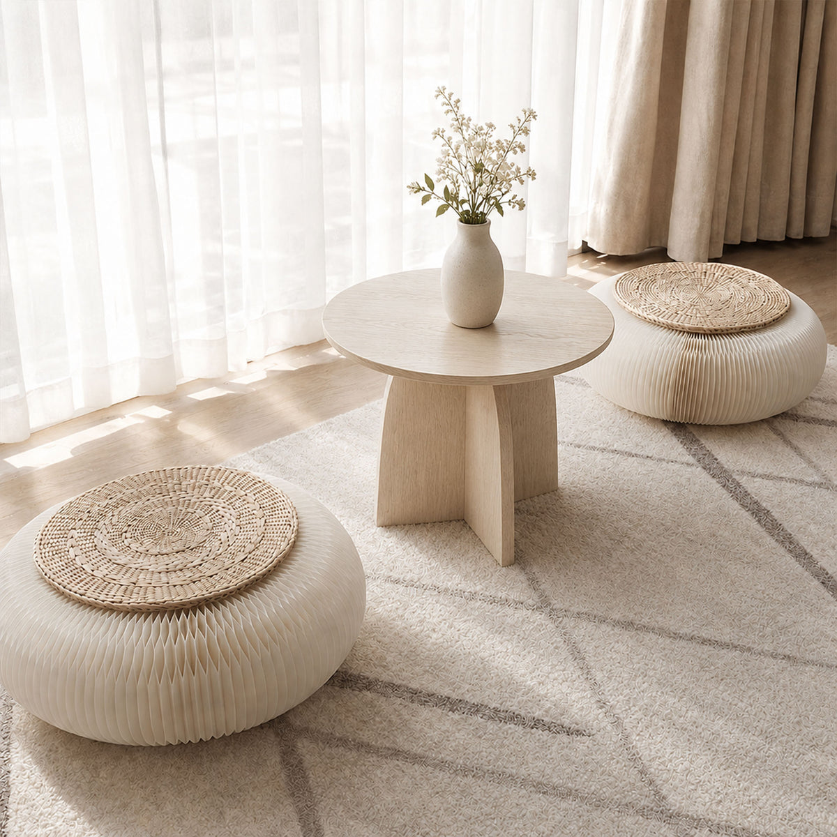 Pair of white Meditation Cushions with rush grass cushions arranged around a low table in a bright indoor tea space