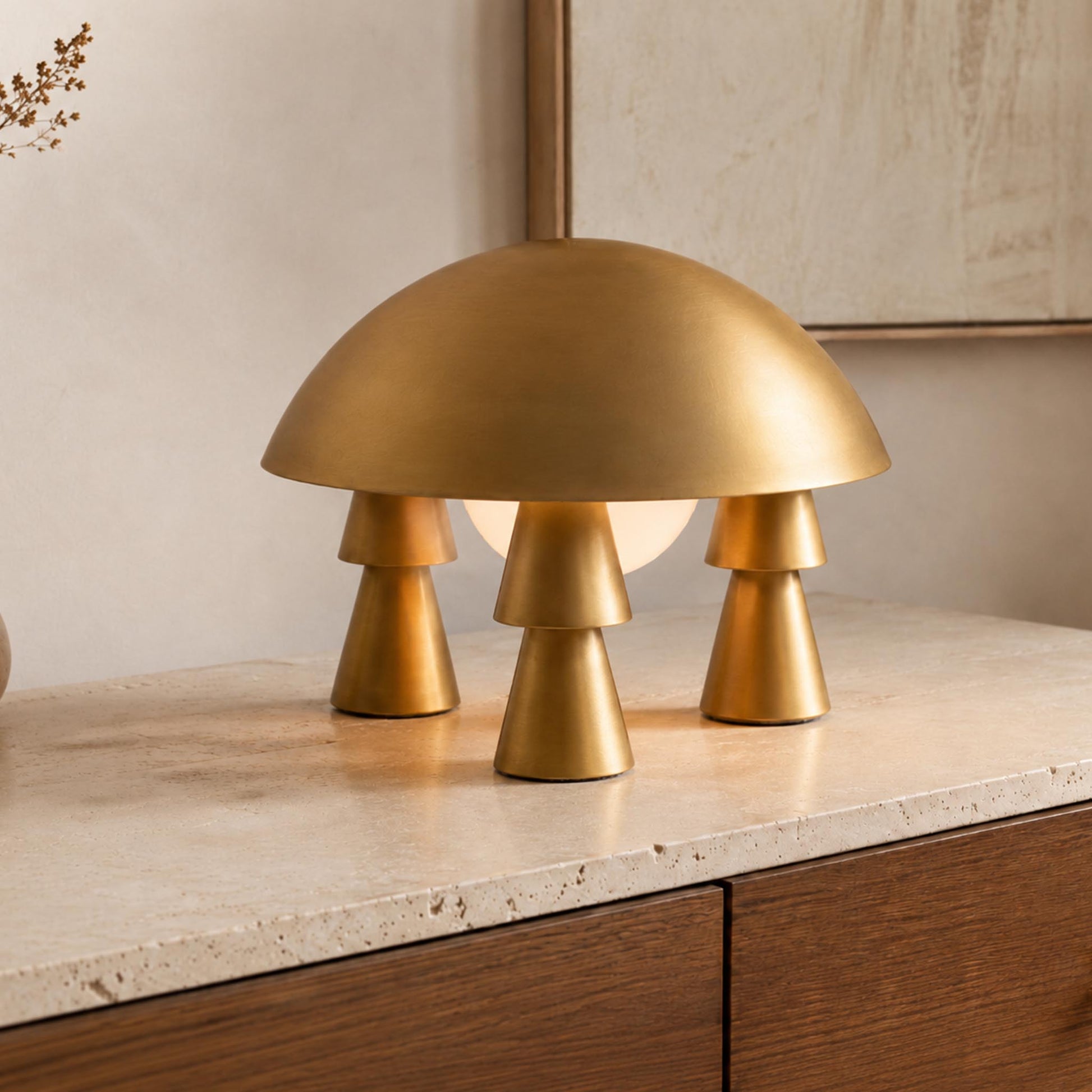Gold-tone Metal Creative Table Lamp with a sculptural dome shade on a stone console for modern home decor.