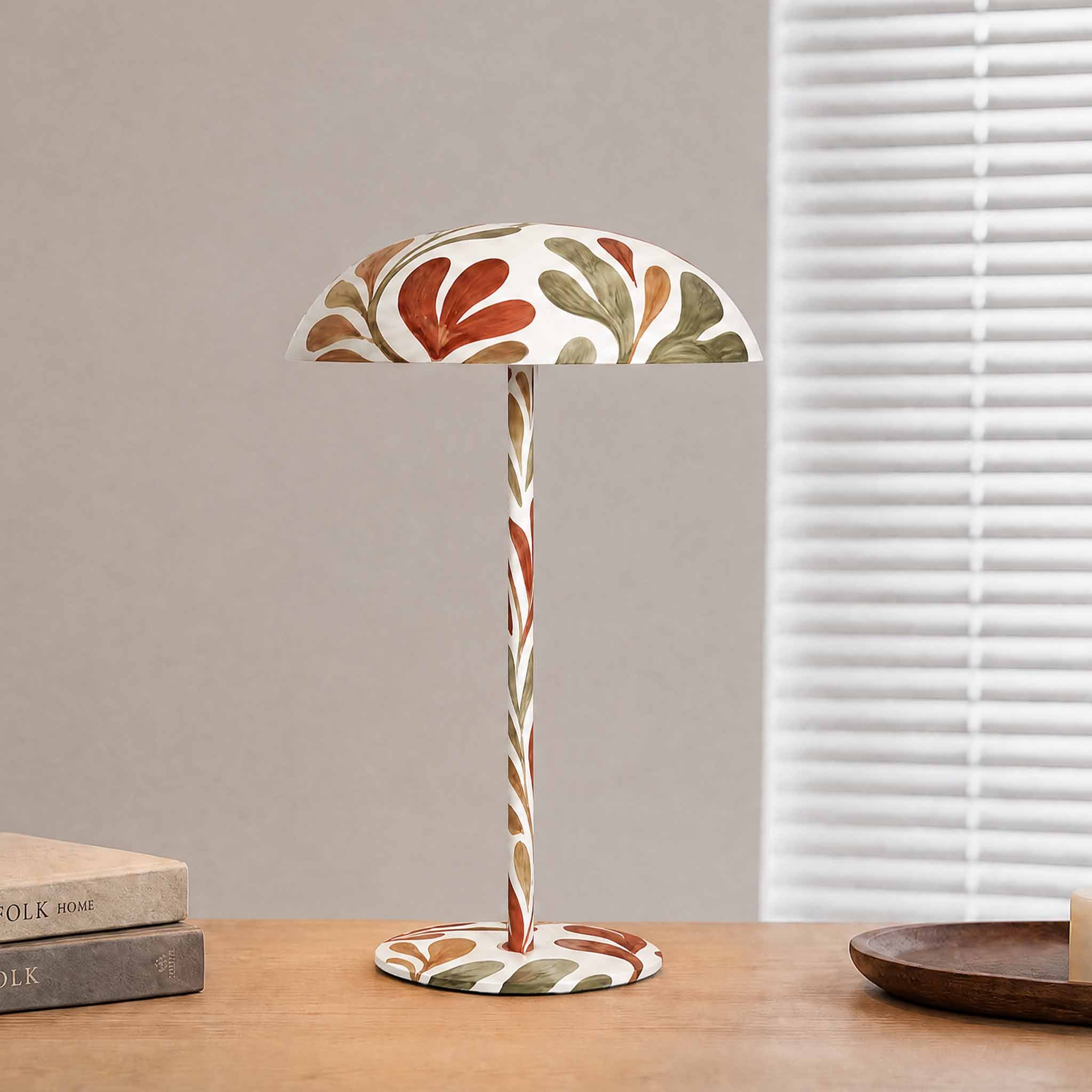 White botanical painted table lamp on a wooden console, designed as artistic lighting for modern home decor.