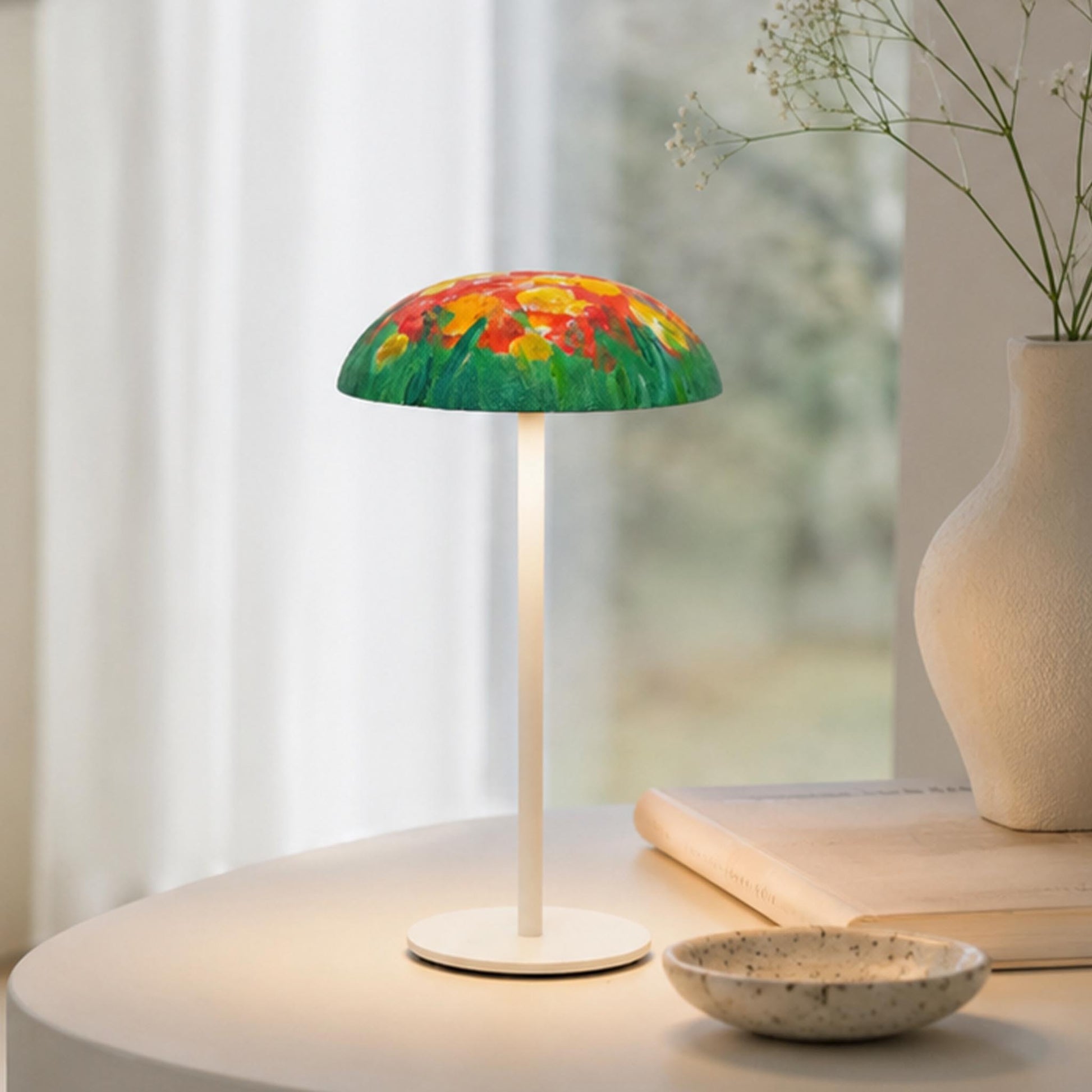 Hand-painted Relax-W table lamp with colorful floral artwork on a modern tabletop with soft ambient light.