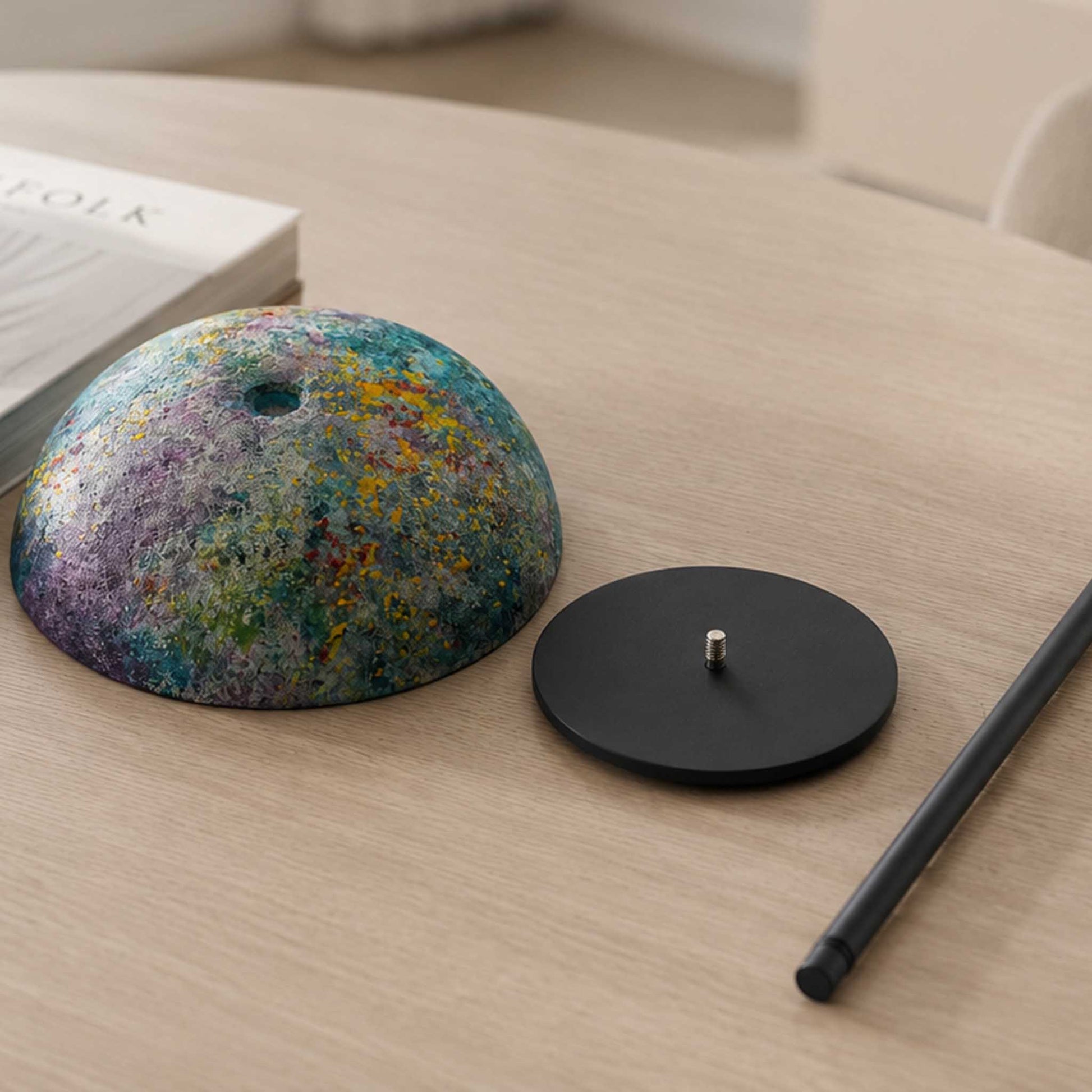 Disassembled Relax-W table lamp with colorful painted shade, dark round base, and slim metal pole.