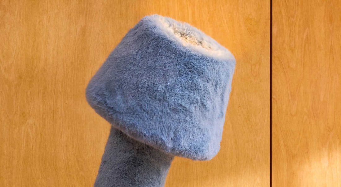 The ARTAMORE faux fur floor lamp integrating seamlessly into a warm minimalist lifestyle, offering both ambient light and daily companionship.